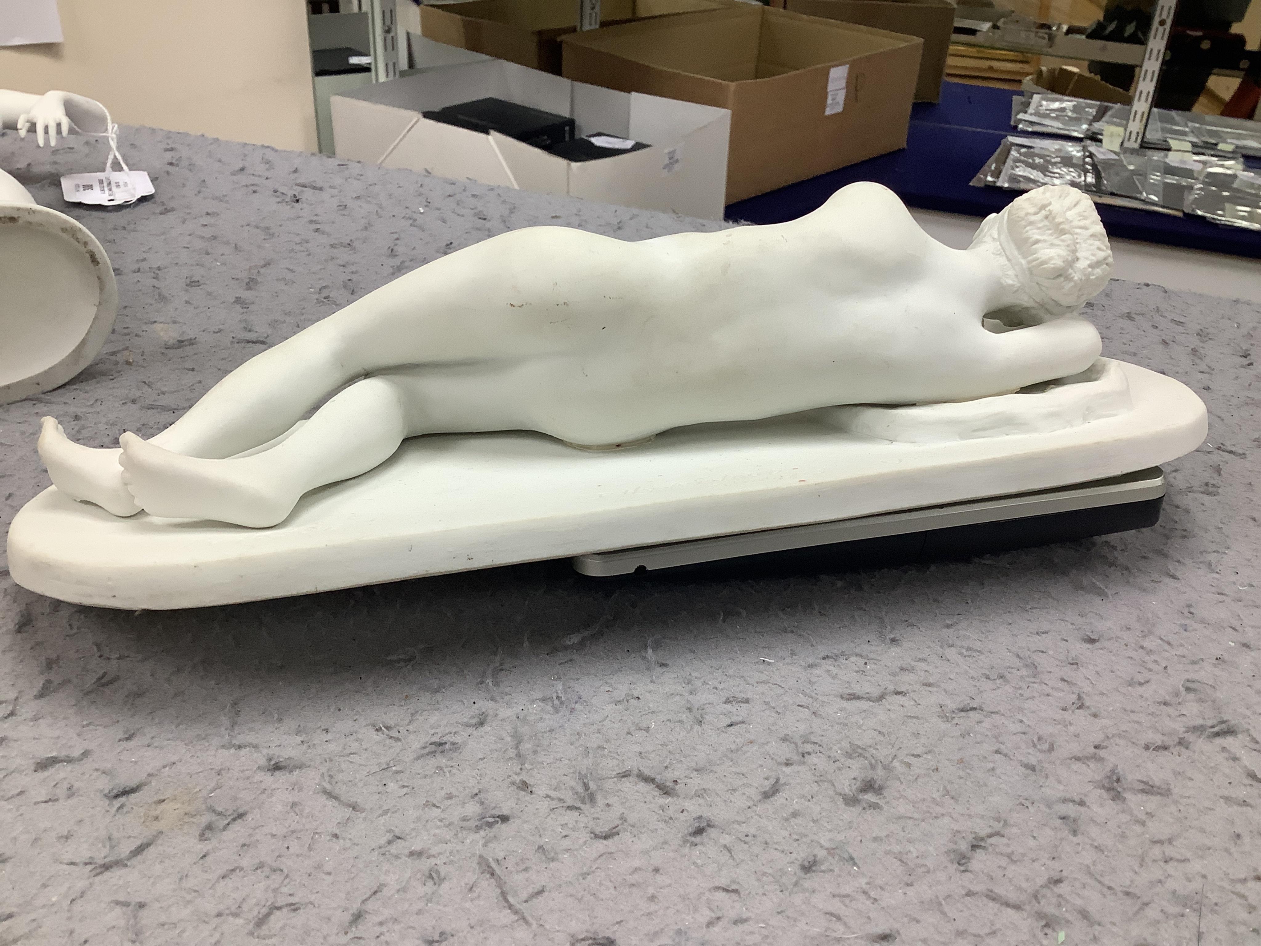 A Limoges bisque reclining female after P. Hyvenaud, 1930, entitled Ivresse, together with a Rosenthal Art Deco Dancer, 31cm wide. Condition - fair